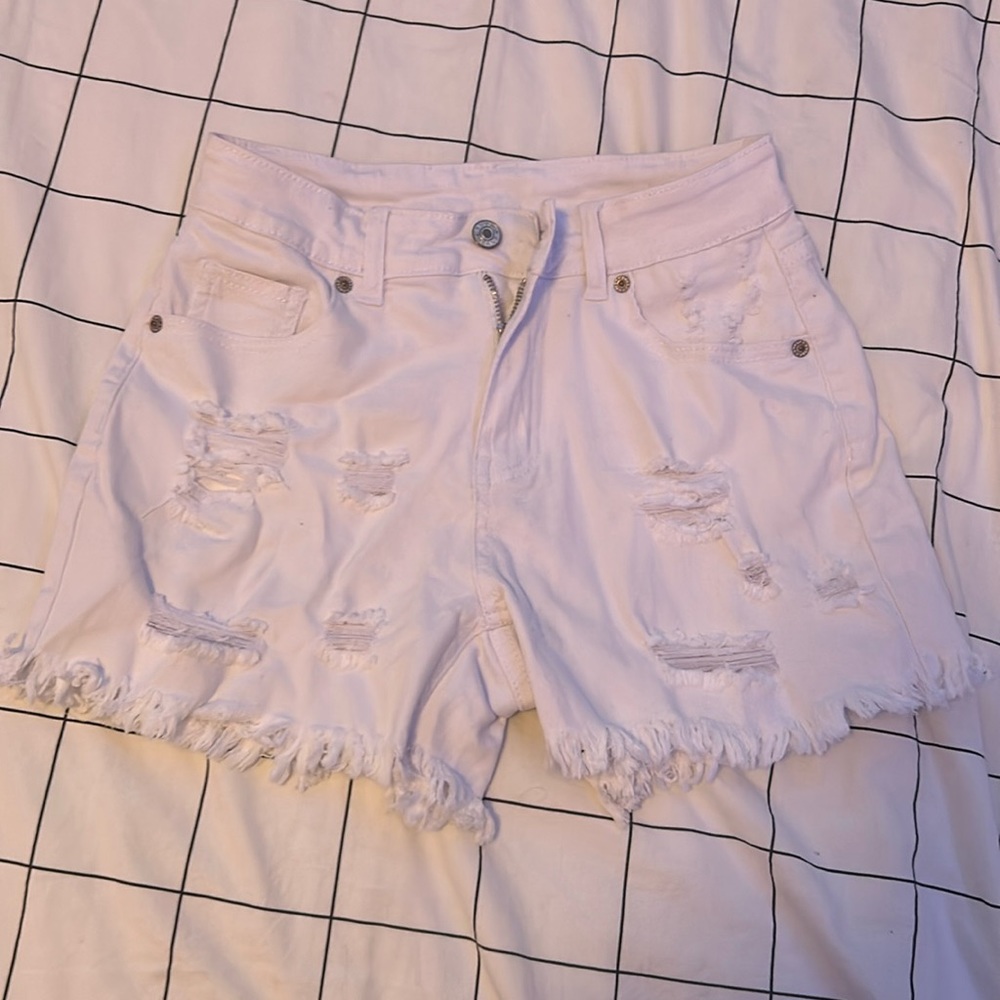 White ripped jean shorts